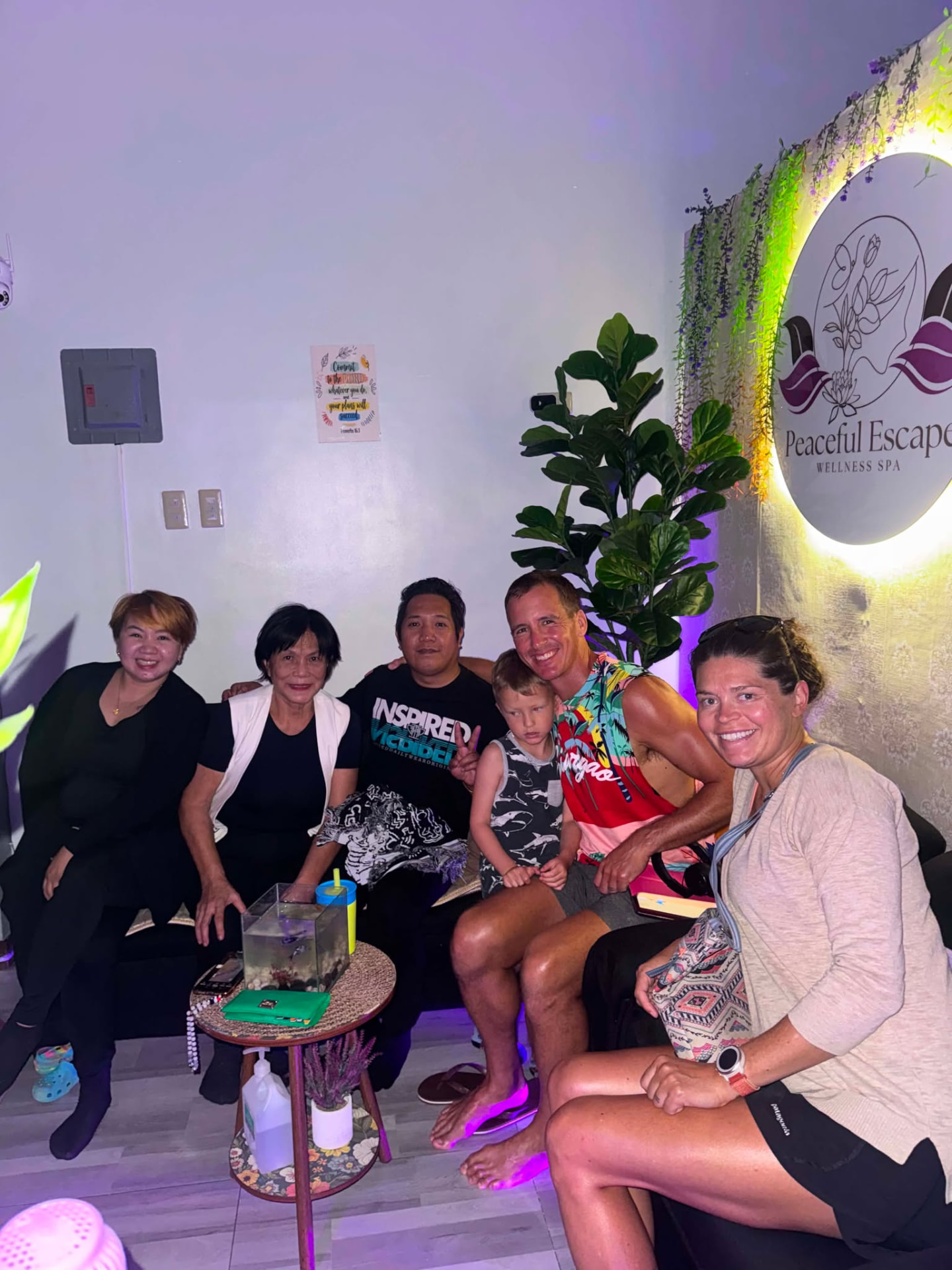 Family of guests relaxing with our team in the spa lounge